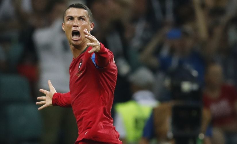 Portugal's Cristiano Ronaldo celebrates his hat-trick against Spain. AFP