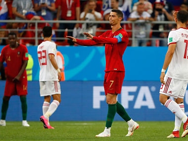 Portugal's forward Cristiano Ronaldo (2nd-R) reacts during the Russia 2018 World Cup Group B football match between Iran and Portugal at the Mordovia Arena in Saransk on June 25, 2018. / AFP PHOTO / Jack GUEZ / RESTRICTED TO EDITORIAL USE - NO MOBILE PUSH ALERTS/DOWNLOADS
