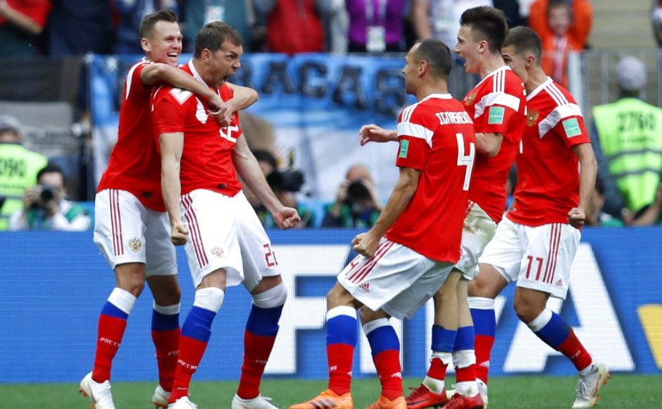 Russia's Artyom Dzyuba, second from left, celebrates after scoring his side's third goal. Dzyuba headed Russia’s third in the 71st minute - 89 seconds after coming on as a substitute. Cheryshev and Aleksandr Golovin hit a further two in injury time, the latter from a free kick, to complete the visitors’ misery. AP Russia's Artyom Dzyuba, second from left, celebrates after scoring his side's third goal. Dzyuba headed Russia’s third in the 71st minute - 89 seconds after coming on as a substitute. Cheryshev and Aleksandr Golovin hit a further two in injury time, the latter from a free kick, to complete the visitors’ misery. AP