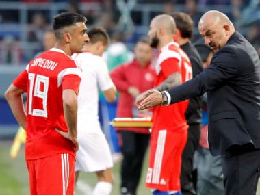 Russia coach Stanislav Cherchesov speaks with Aleksandr Samedov. Reuters