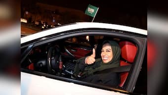 Saudi Arabian women face backlash after authorities overturn ban on female driving; most remain defiant