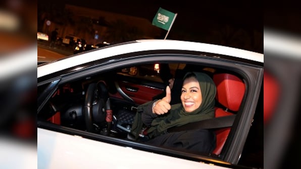 Saudi Arabian women face backlash after authorities overturn ban on female driving; most remain defiant