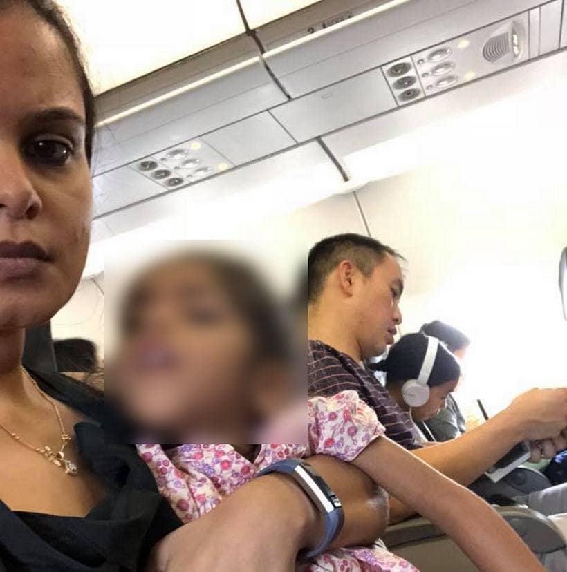 Divya George with her child onboard Scoot aircraft. Facebook @DivyaGeorge