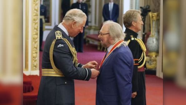 Bee Gees singer Barry Gibb honoured with knighthood by Prince Charles at Buckingham Palace