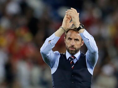 England head coach Gareth Southgate greets spectators after losing the group G match against Belgium. AP