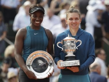 Simona Halep, right, holds the French Open trophy as she poses with runner-up Sloane Stephens after the final. AP
