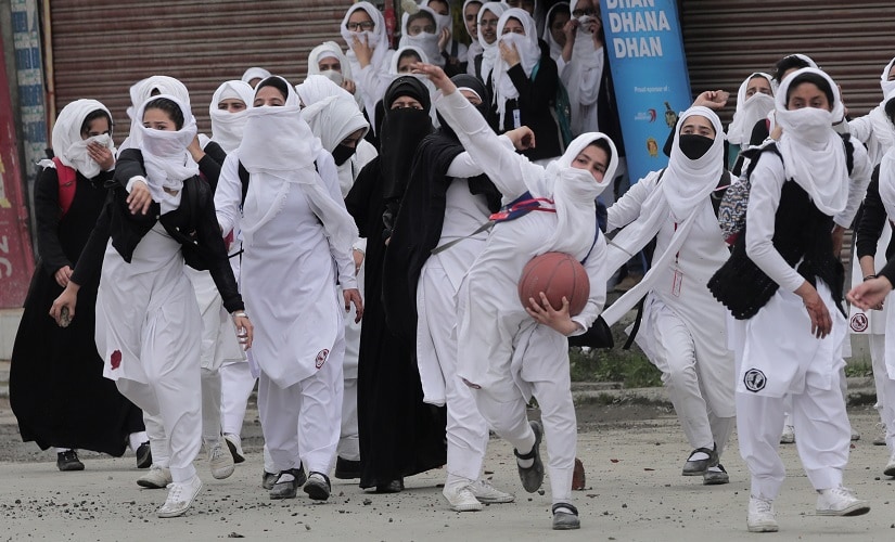 Students pelting stones in Kashmir during a protest in 2017. Image courtesy 101Reporters