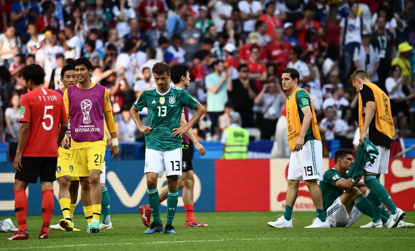 Germany's forward Thomas Mueller (C) and his teammates react at the end of the game against South Korea. AFP