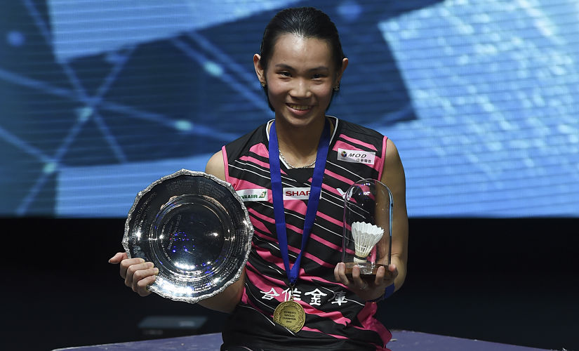 Taiwan's Tai Tzu-ying poses on the podium after beating Japan's Akane Yamaguchi in the women's singles final at the All England Open Badminton Championships in Birmingham, central England, on March 18, 2018. / AFP PHOTO / PAUL ELLIS