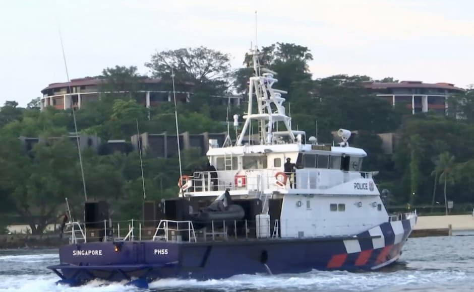 In this image from a video, a Singapore police coast guard vessel patrols the waters off Sentosa and seen in the background is the summit venue, the Capella Hotel on Sunday. AP In this image from a video, a Singapore police coast guard vessel patrols the waters off Sentosa and seen in the background is the summit venue, the Capella Hotel on Sunday. AP