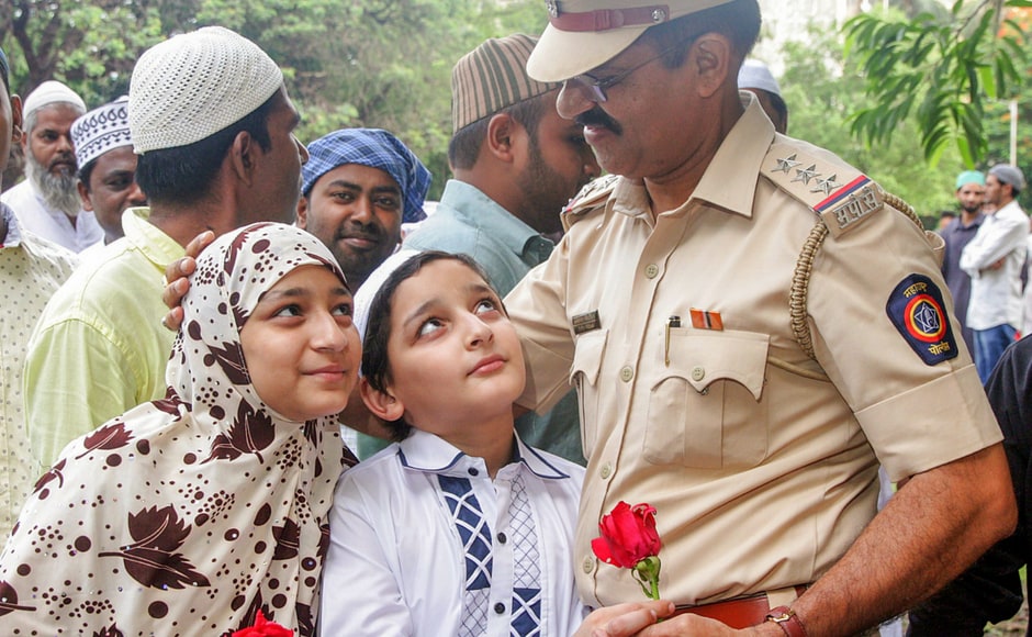 Children hugged policemen on the occasion of Eid-ul-Fitr in Mumbai. They offered flowers, sweets and thanked them for their service. PTI Children hugged policemen on the occasion of Eid-ul-Fitr in Mumbai. They offered flowers, sweets and thanked them for their service. PTI