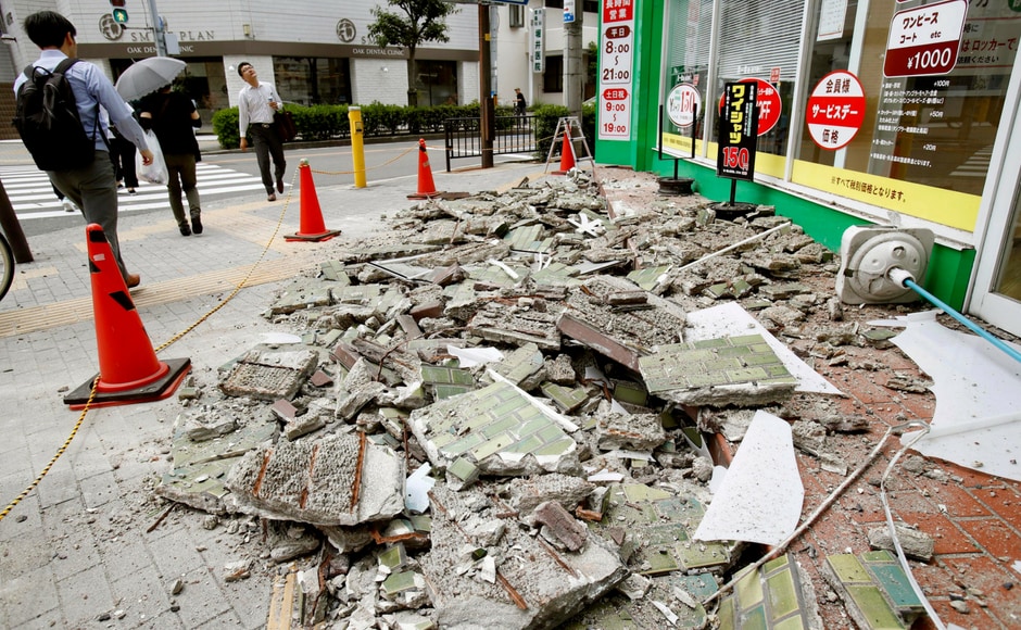 Walls were knocked over all over the city and the death toll is 3 till now. Kyodo News via AP