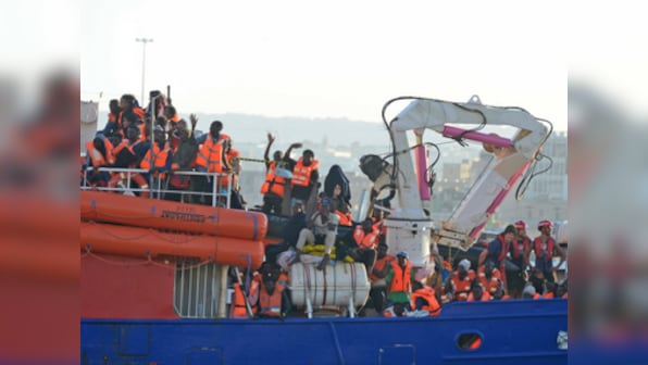 Boat carrying 200 Libyan migrants docks in Malta after a week at sea as EU member countries agree to take them in