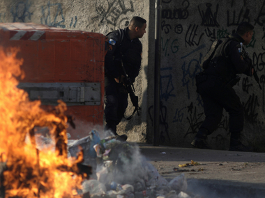 Violence between army-backed police and criminal gangs in Rio de Janeiro kills seven including 14-year-old boy Violence between army-backed police and criminal gangs in Rio de Janeiro kills seven including 14-year-old boy