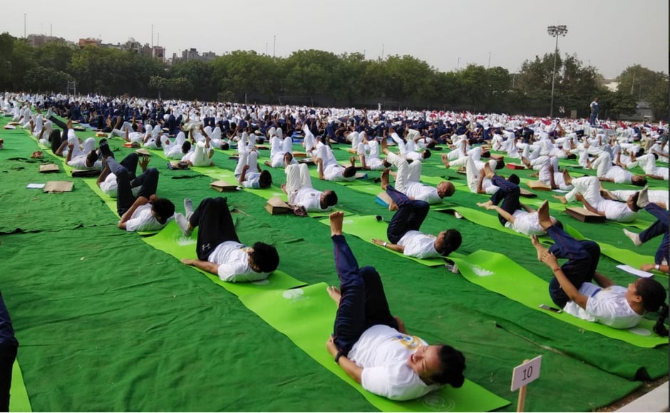 Delhi Police members perform yoga in Thyagaraj Stadium in New Delhi. The police commissioner said that the lifestyle of a police person was full of stress and stated he wanted to spread more awareness about yoga in the department. Twitter/@PIB_India Delhi Police members perform yoga in Thyagaraj Stadium in New Delhi. The police commissioner said that the lifestyle of a police person was full of stress and stated he wanted to spread more awareness about yoga in the department. Twitter/@PIB_India