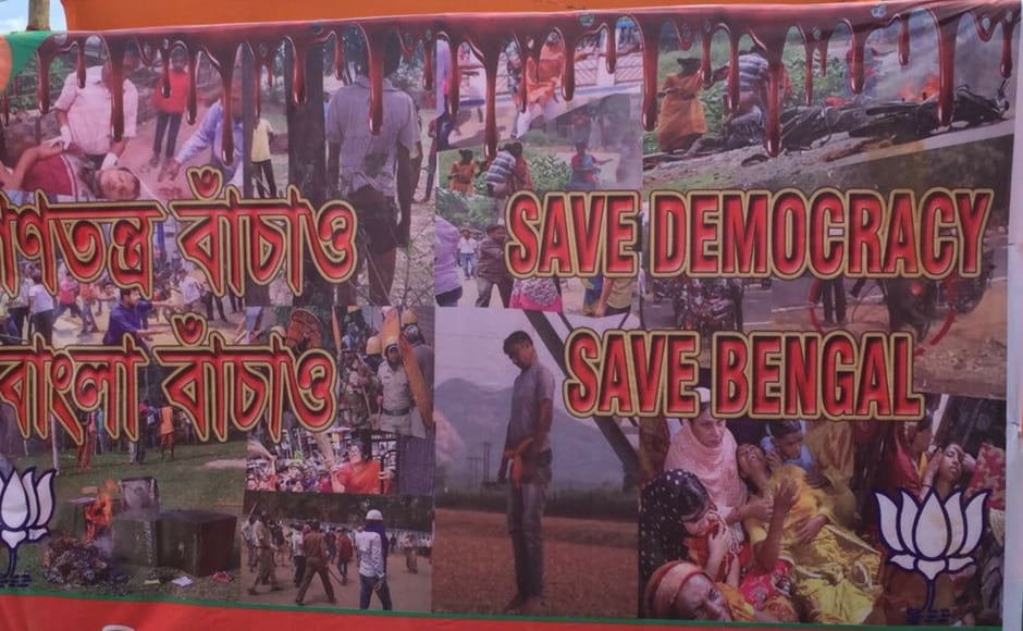 Posters at the Amit Shah rally call for democracy. Pointing out to the ‘dire state of infrastructure’ in the state, the BJP president accused the TMC of depriving the state of clean water and electricity. He also questioned the TMC govt on why it had failed to stop illegal immigration from Bangladesh and slammed Mamata for her efforts to stitch together a grand alliance. Firstpost/Amitesh Posters at the Amit Shah rally call for democracy. Pointing out to the ‘dire state of infrastructure’ in the state, the BJP president accused the TMC of depriving the state of clean water and electricity. He also questioned the TMC govt on why it had failed to stop illegal immigration from Bangladesh and slammed Mamata for her efforts to stitch together a grand alliance. Firstpost/Amitesh