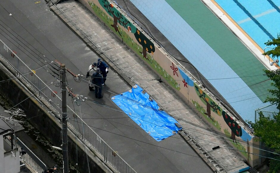 A 9-year-old girl in Takatsuki, Osaka Prefecture, was confirmed dead after being struck when a wall surrounding a swimming pool fell on her as she walked by. She was just one of the three who were killed. Kyodo News via AP