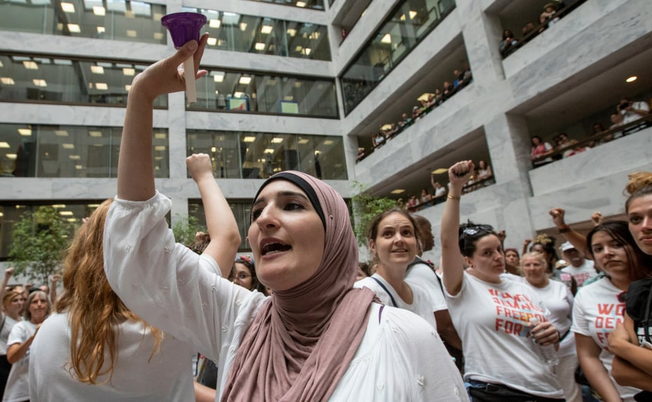 Linda Sarsour, co-chair of the Women’s March who is seen ringing a bell said that civil disobedience was a strategic intentional tactic. AP Linda Sarsour, co-chair of the Women’s March who is seen ringing a bell said that civil disobedience was a strategic intentional tactic. AP