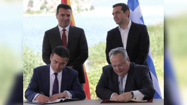 Macedonia, Greece sign agreement to resolve decades-long dispute over former's name amid protests