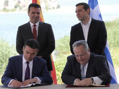 Macedonia, Greece sign agreement to resolve decades-long dispute over former's name amid protests