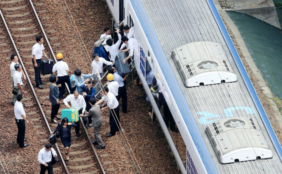 More than 60 bullet trains were canceled during the morning, and some expressways were also closed. Kyodo News via AP