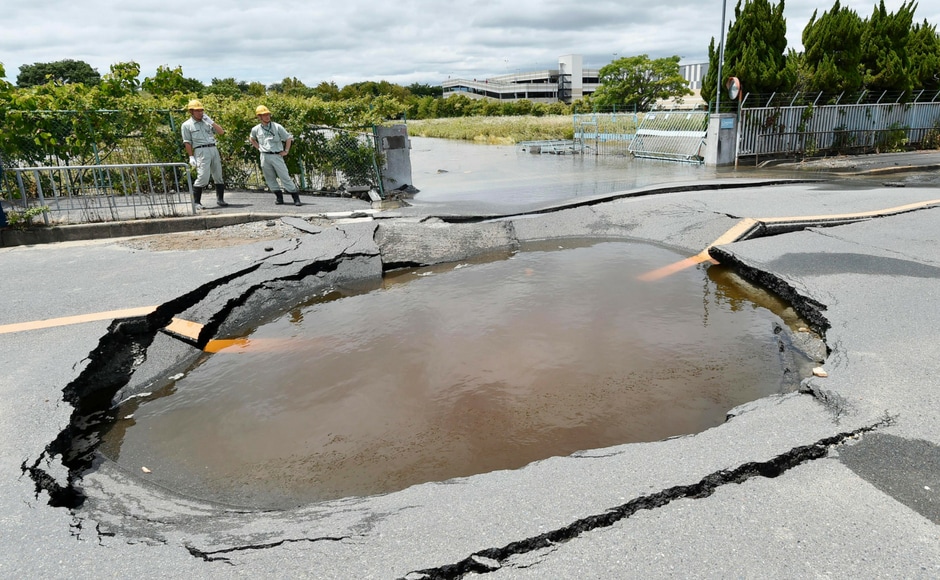 Water pipes burst after the earthquake. Kyodo News via AP.