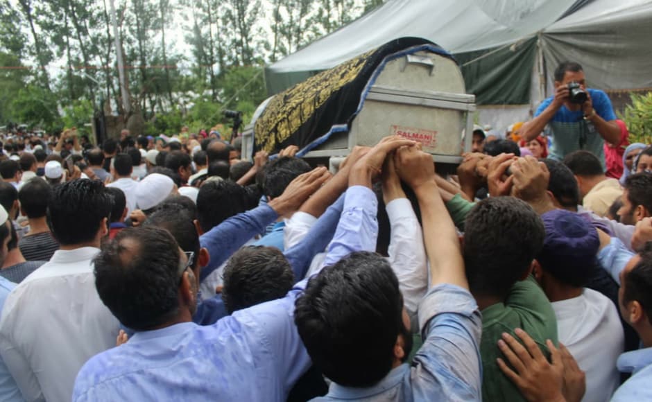 Bukhari was laid to rest at his native place, Kreeri in Baramulla district, where his ancestral graveyard is located. Meanwhile, The Rising Kashmir, which hit the stands as usual, carried its former editor-in-chief's black and white picture against a black background. The newspaper also carried the message that it would not be cowed by cowards who had snatched him from them. Sameer Yasir/Firstpost Bukhari was laid to rest at his native place, Kreeri in Baramulla district, where his ancestral graveyard is located. Meanwhile, The Rising Kashmir, which hit the stands as usual, carried its former editor-in-chief's black and white picture against a black background. The newspaper also carried the message that it would not be cowed by cowards who had snatched him from them. Sameer Yasir/Firstpost