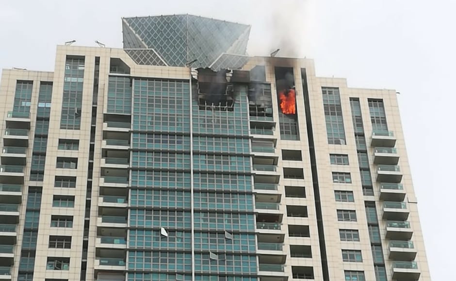 The fire has spread to the left side of the tower on the 33rd and 32nd floors.Rescue operations are halted with fire fighters and cops baffled because they don't know how to reach those floors. This is the third time this building caught fire. Image courtesy: Nevin Thomas The fire has spread to the left side of the tower on the 33rd and 32nd floors.Rescue operations are halted with fire fighters and cops baffled because they don't know how to reach those floors. This is the third time this building caught fire. Image courtesy: Nevin Thomas
