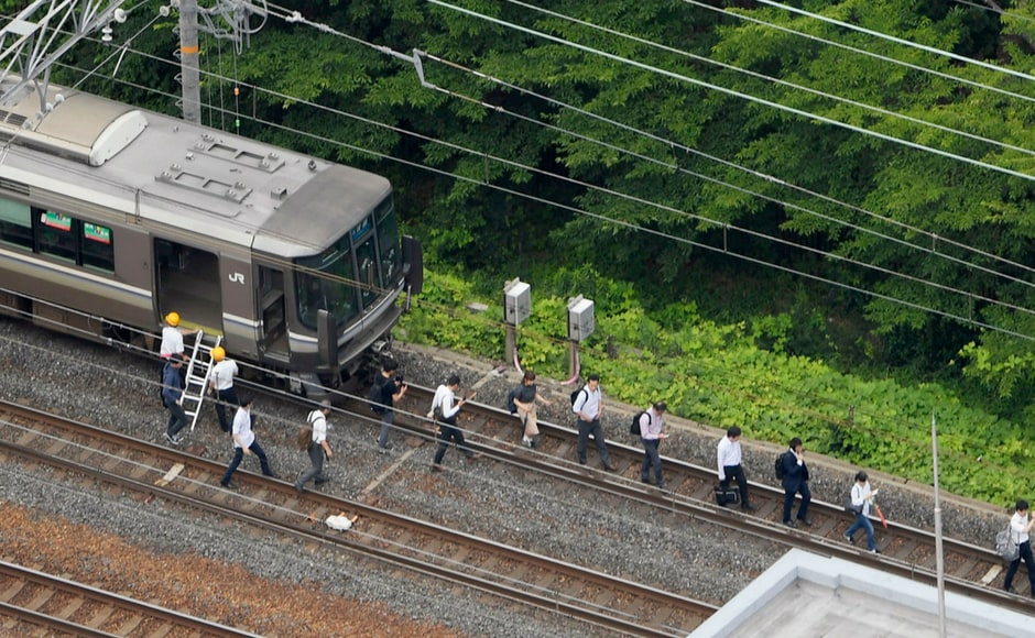 People were asked to evacuate the trains en route when the tremors were felt. Kyodo News via AP