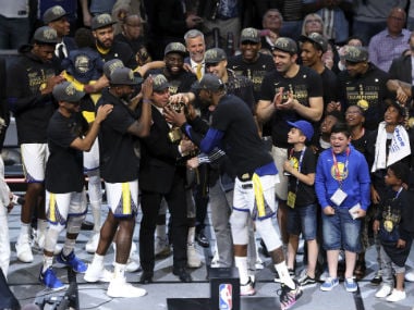 The Golden State Warriors celebrate after the Warriors defeated the Cleveland Cavaliers 108-85 in Game 4 of basketball's NBA Finals to win the NBA championship. AP
