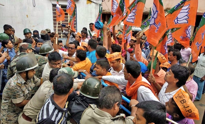 BJP workers clash with police over the alleged killing of BJP Dalit supporter in Purulia. PTI