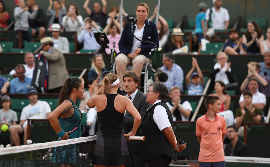 Russia's Darya Kasatkina and Denmark's Caroline Wozniacki speak with officials during their women's singles fourth round match. Wozniacki and 14th seed Kasatkina will return to Court Philippe Chatrier on Monday with the Russian leading 7-6 (5), 3-3, after their match was halted when darkness fell. AFP Russia's Darya Kasatkina and Denmark's Caroline Wozniacki speak with officials during their women's singles fourth round match. Wozniacki and 14th seed Kasatkina will return to Court Philippe Chatrier on Monday with the Russian leading 7-6 (5), 3-3, after their match was halted when darkness fell. AFP