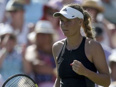 Eastbourne International: Caroline Wozniacki saves match point in win