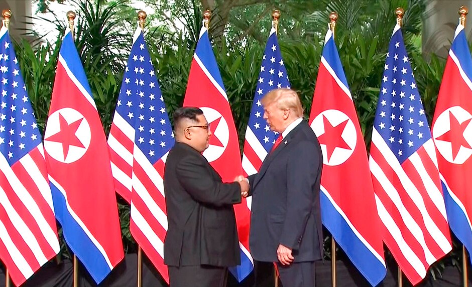 US president Donald Trump shakes hands with North Korea leader Kim Jong-un at the Capella resort on Sentosa Island in Singapore ahead of the historic summit on Tuesday. AP US president Donald Trump shakes hands with North Korea leader Kim Jong-un at the Capella resort on Sentosa Island in Singapore ahead of the historic summit on Tuesday. AP
