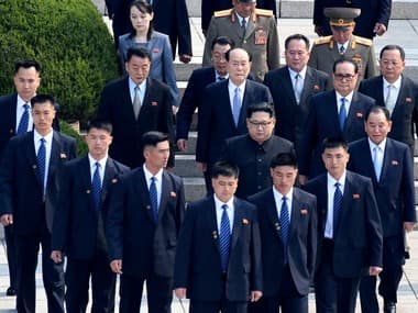 Kim Jong-un flanked by security guards. File image. AP