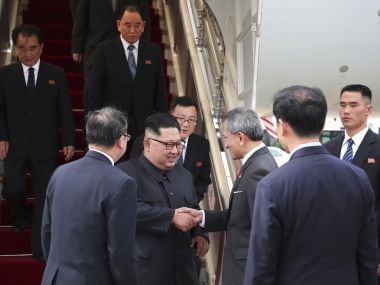 North Korean leader Kim Jong-un is greeted by Singapore Minister for Foreign Affairs Dr. Vivian Balakrishnan at the Changi International Airport on Sunday. AP