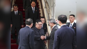 Donald Trump, Kim Jong-un land in Singapore ahead of high-stakes summit which will open with one-on-one meeting