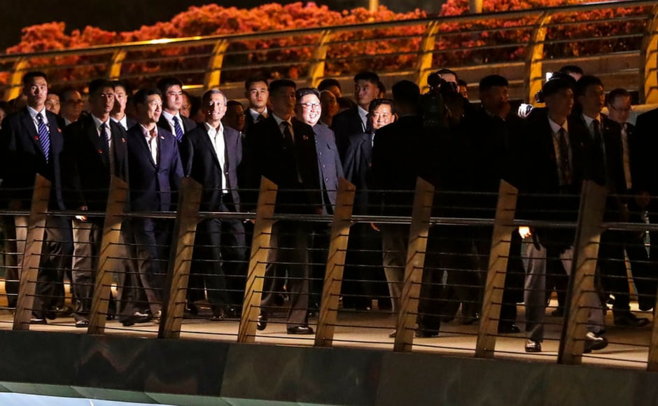Kim emerged in his trademark Mao-style suit to walk out to his black limousine, accompanied by his sister, Kim Yo-jong, and aides. AP Kim emerged in his trademark Mao-style suit to walk out to his black limousine, accompanied by his sister, Kim Yo-jong, and aides. AP