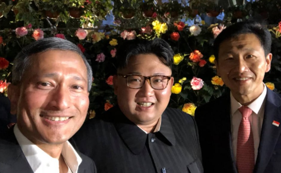 He joined Singapore's foreign minister, Vivian Balakrishnan, who tweeted a selfie with a smiling Kim and Singapore education minister Ong Ye Kung, against a backdrop of flowers with the hashtag Guesswhere. Twitter @VivianBala He joined Singapore's foreign minister, Vivian Balakrishnan, who tweeted a selfie with a smiling Kim and Singapore education minister Ong Ye Kung, against a backdrop of flowers with the hashtag Guesswhere. Twitter @VivianBala