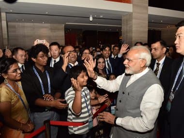 Members of the Indian diaspora in China welcome Narendra Modi in Qingdao, China. Twitter/@PMOIndia