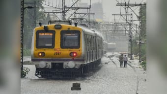 Heavy Mumbai rains claim three lives as traffic comes to standstill, road caves in and several flights are delayed
