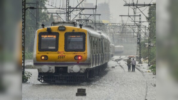 Heavy Mumbai rains claim three lives as traffic comes to standstill, road caves in and several flights are delayed
