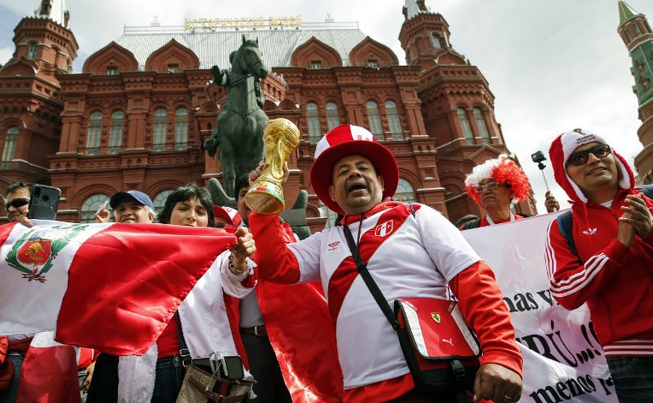 Supporters of Peruvian national football team cheer on Manezhnaya Square in downtown Moscow on 14 June 2018, hours before the opening match of the Russia 2018 World Cup football tournament. AFP. Supporters of Peruvian national football team cheer on Manezhnaya Square in downtown Moscow on 14 June 2018, hours before the opening match of the Russia 2018 World Cup football tournament. AFP.