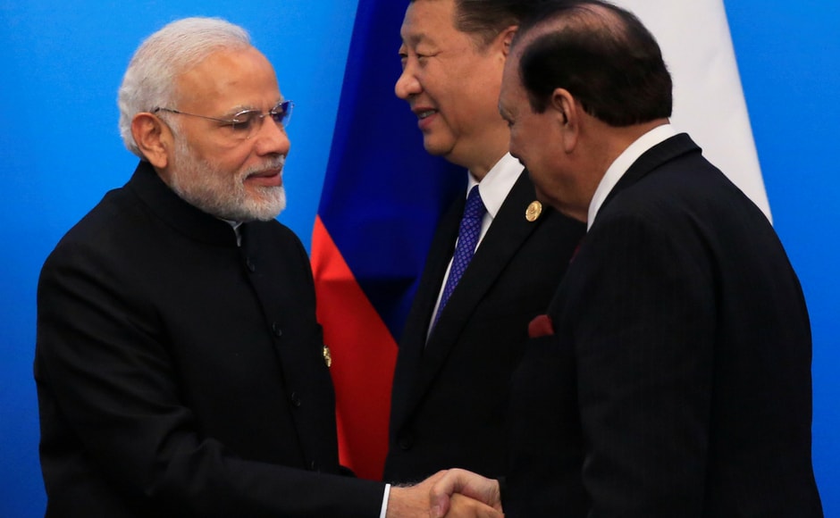 Modi and Pakistan's president Mamnoon Hussain exchanged pleasantries after a press conference by the leaders of the SCO. Modi and Hussain attended the summit for the first time after both countries were were admitted as members of the SCO in 2017. Reuters Modi and Pakistan's president Mamnoon Hussain exchanged pleasantries after a press conference by the leaders of the SCO. Modi and Hussain attended the summit for the first time after both countries were were admitted as members of the SCO in 2017. Reuters