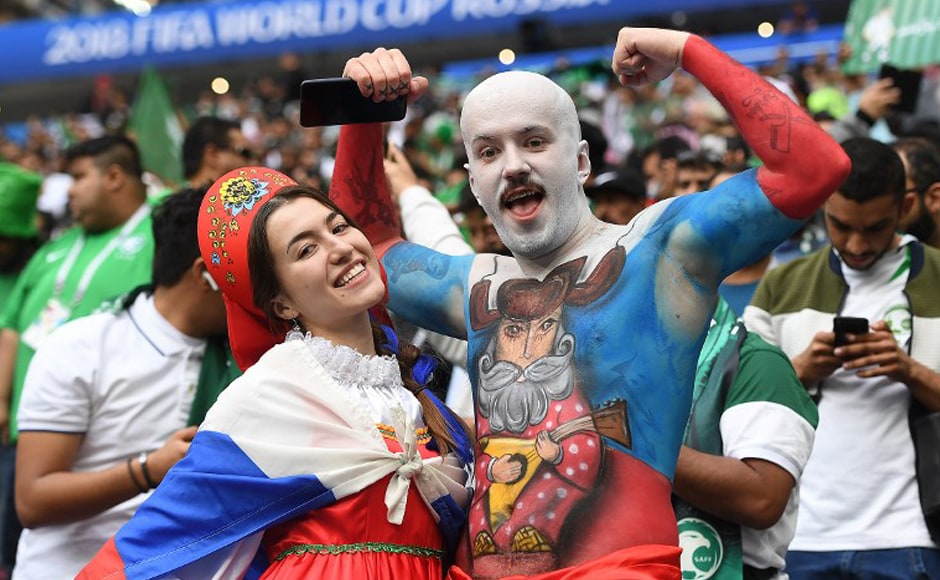 Russia fans pose as they wait for the start of the Russia 2018 World Cup Group A football match between Russia and Saudi Arabia at the Luzhniki Stadium in Moscow on 14 June, 2018. AFP Russia fans pose as they wait for the start of the Russia 2018 World Cup Group A football match between Russia and Saudi Arabia at the Luzhniki Stadium in Moscow on 14 June, 2018. AFP