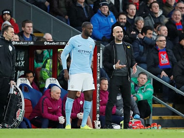 File image of Manchester City's Yaya Toure and manager Pep Guardiola. Reuters