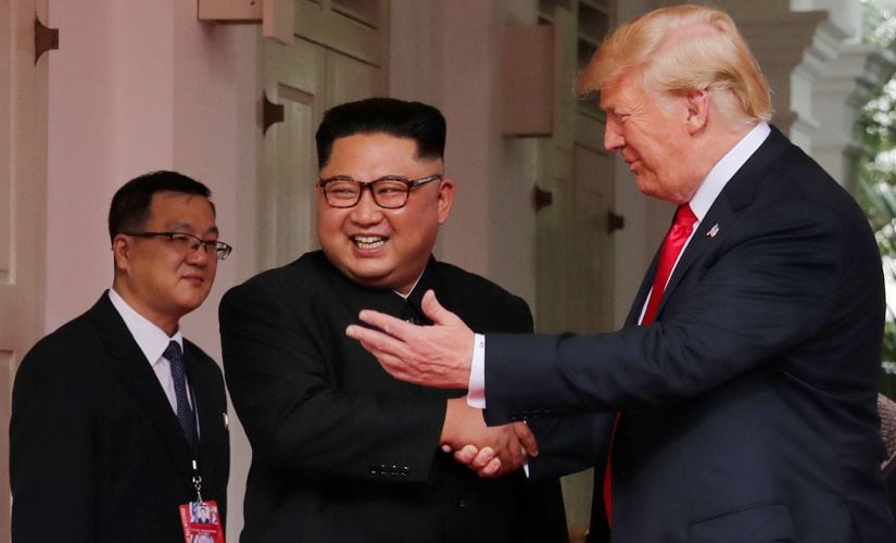 US President Donald Trump with North Korea Chairman Kim Jong-un at Capella Hotel in Sentosa Island on Tuesday. Reuters