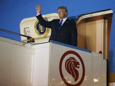 President Donald Trump arrives at Paya Lebar Air Base for a summit with Kim Jong-un on Sunday. AP