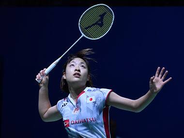 Nozomi Okuhara of Japan plays a return against Akane Yamaguchi of Japan during their women’s singles badminton match at the Indonesia Open in Jakarta on July 5, 2018. / AFP PHOTO / ADEK BERRY