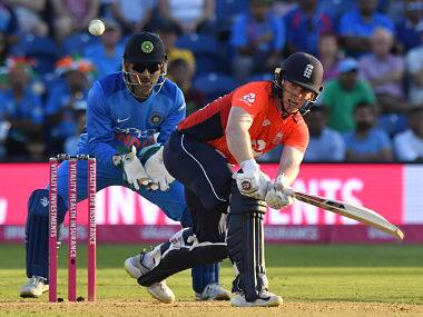 England’s Eoin Morgan (R) bats as India’s MS Dhoni keeps wicket during the international Twenty20 cricket match between England and India at Sophia Gardens in Cardiff, south Wales, on July 6, 2018. / AFP PHOTO / Anthony DEVLIN / RESTRICTED TO EDITORIAL USE. NO ASSOCIATION WITH DIRECT COMPETITOR OF SPONSOR, PARTNER, OR SUPPLIER OF THE ECB